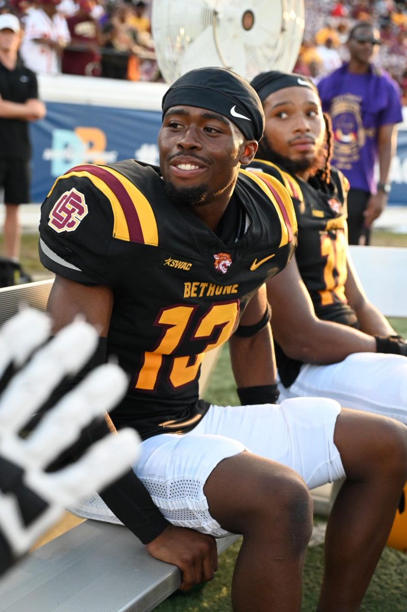 Bethune-Cookman player Cornerback Naim Lassiter share smiles on the sideline during the Wildcats’ Homecoming matchup on October 25, 2025.
